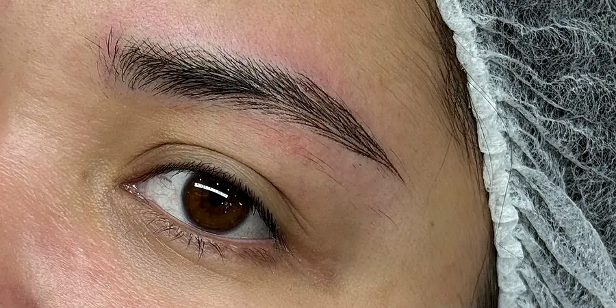 Nano Brows on a Brow Space client right after the session: crisp, slightly darker strokes with some redness